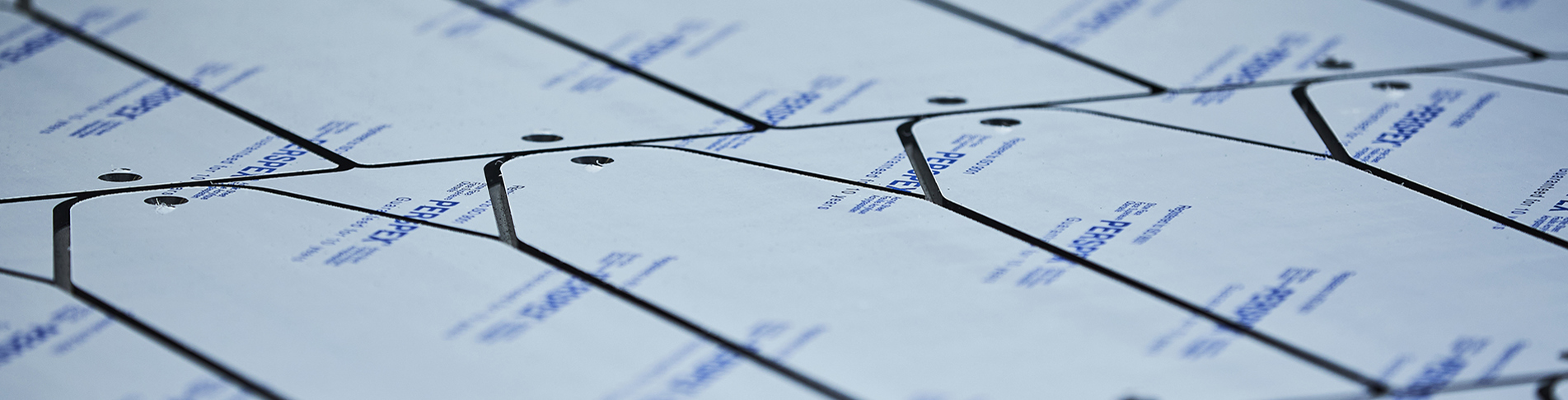 Carved parts in black acrylic cut out on a cutting plotter