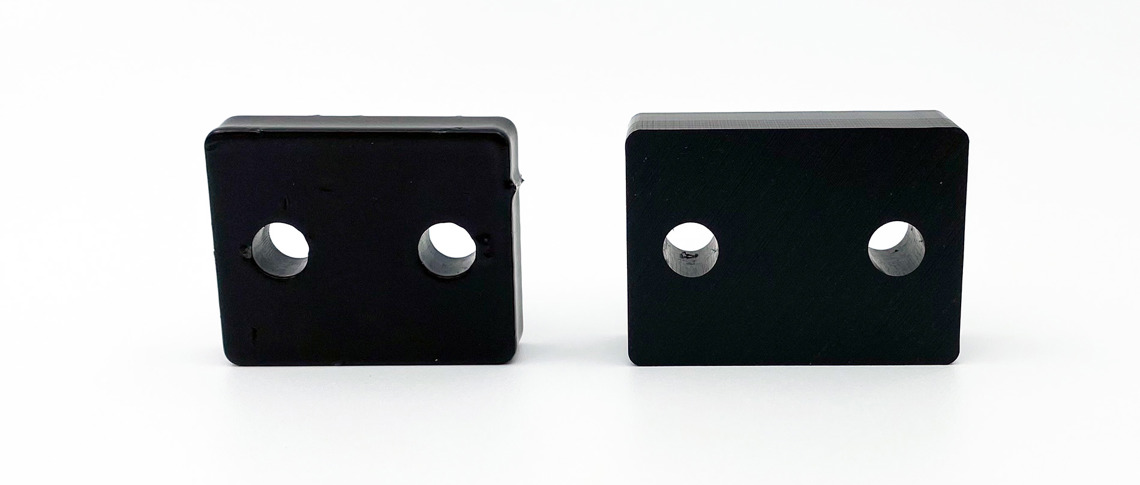 Two identical spacers, one made of plastics and one made of metal