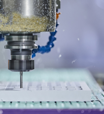 CNC milling mill a part in white plastic with many holes