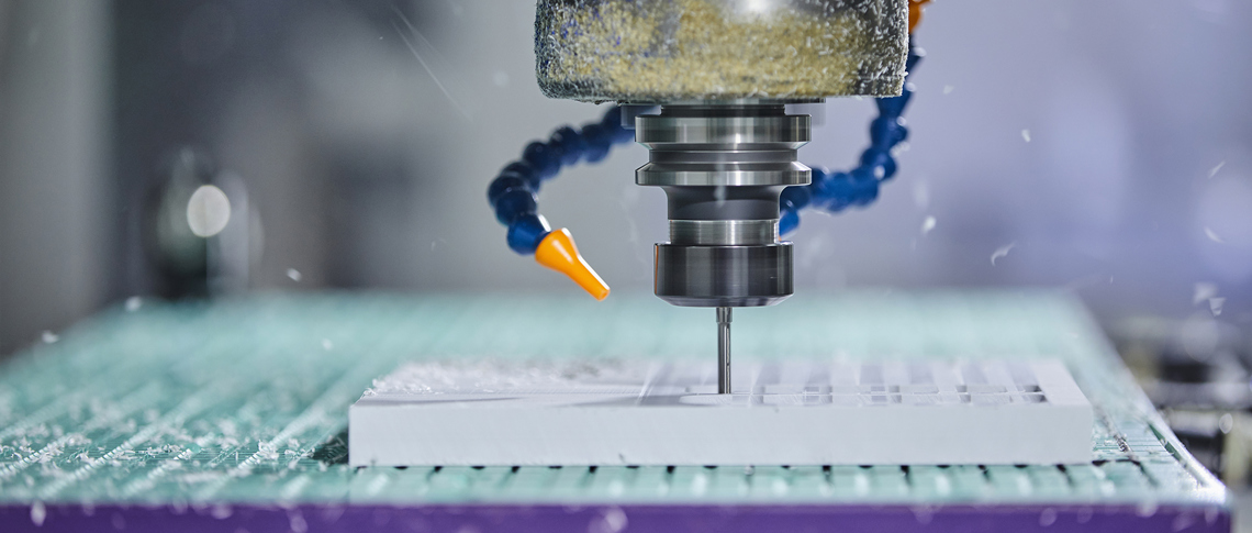 CNC milling mill a part in white plastic with many holes