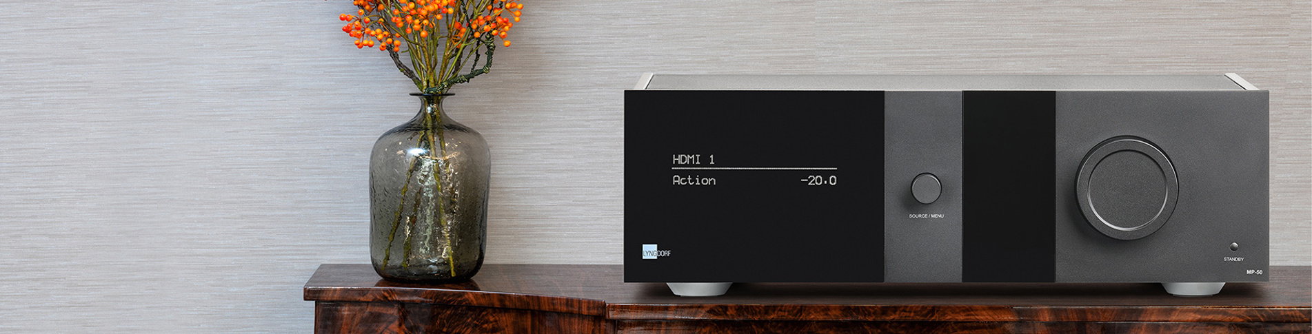 Hi-fi system from Lyngdorf Audio with black acrylic display screen displayed on a table