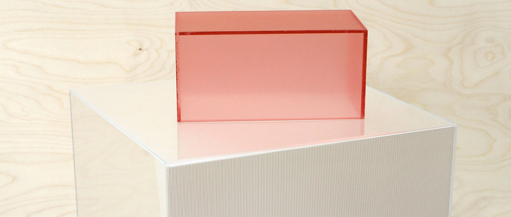 Three acrylic boxes in pink, clear and grey